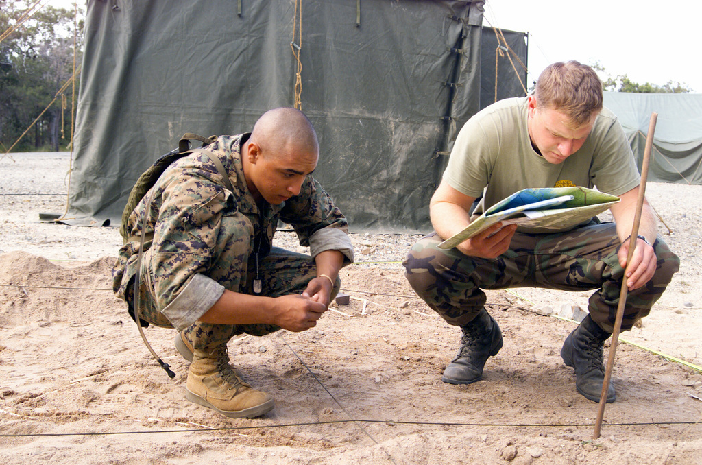 US Marine Corps (USMC) Private First Class (PFC) Florez (left), Eco ...