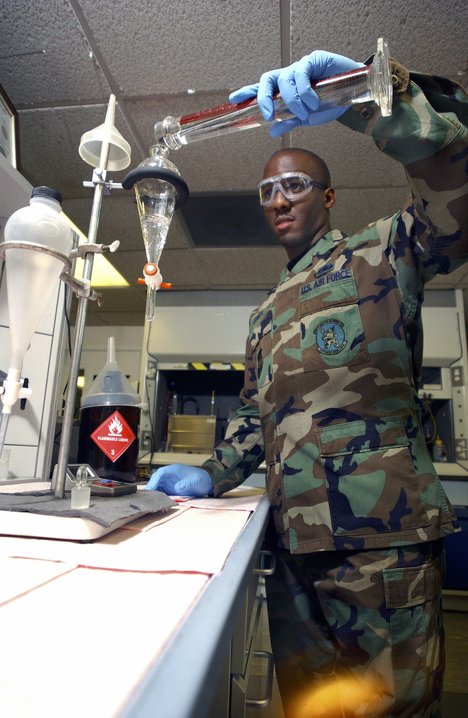 US Air Force (USAF) STAFF Sergeant (SSGT) Rasmus O. James pours jet