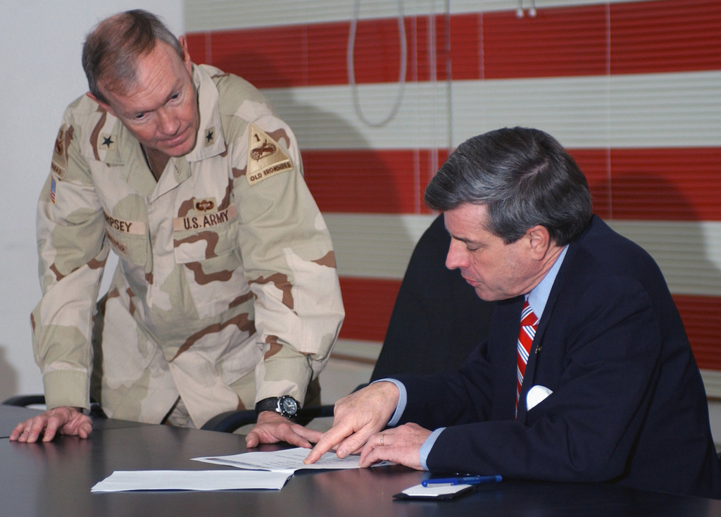 Coalition Provisional Authority Administrator Cpaa Ambassador L Paul Bremer Is Briefed By Us Army Usa Brigadier General Bgen Martin E Dempsey 1st Armored Division Ad About Plans For Renovation Of The Iraq