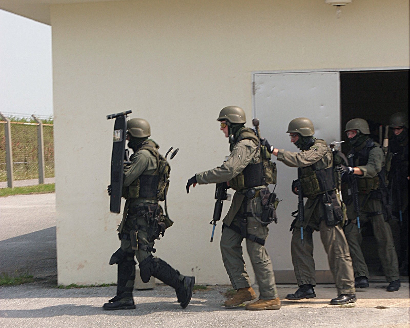 A Us Marine Corps Usmc Special Reaction Team Srt Exits Their Assemblage Building As They Move