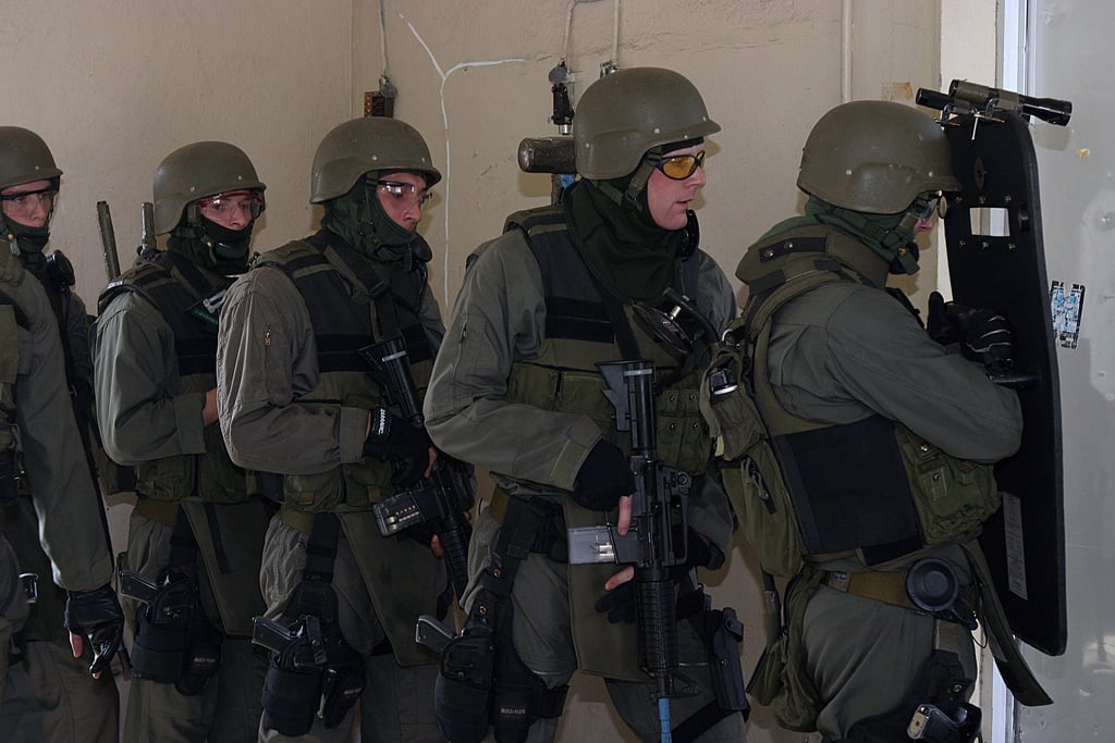 A Us Marine Corps Usmc Special Reaction Team Srt Prepares To Charge Into A Room To