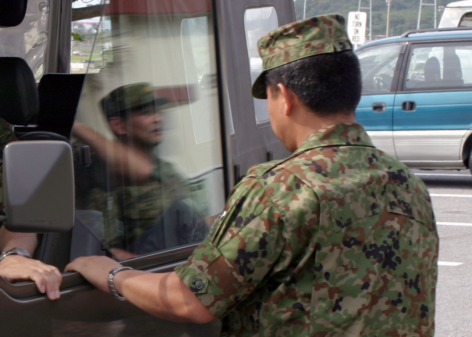 A Japanese Ground Self Defense Force (JGSDF) soldier prepares to depart ...