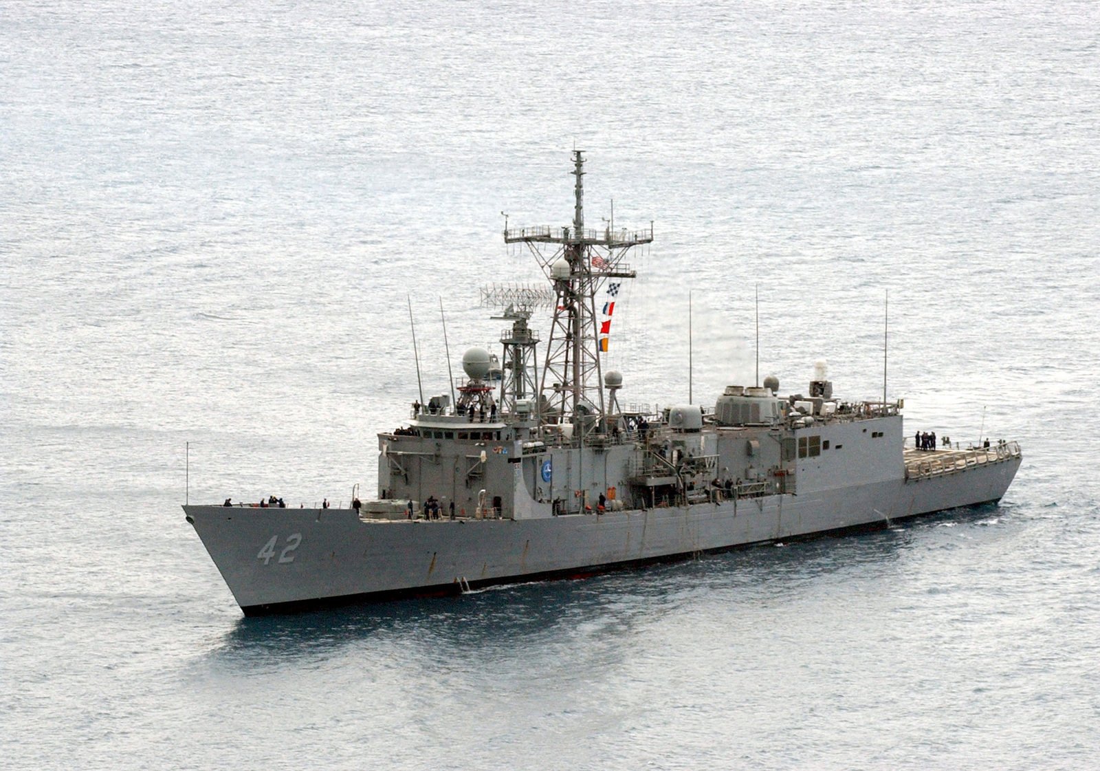 An aerial port bow view of the US Navy (USN) OLIVER HAZARD PERRY CLASS ...