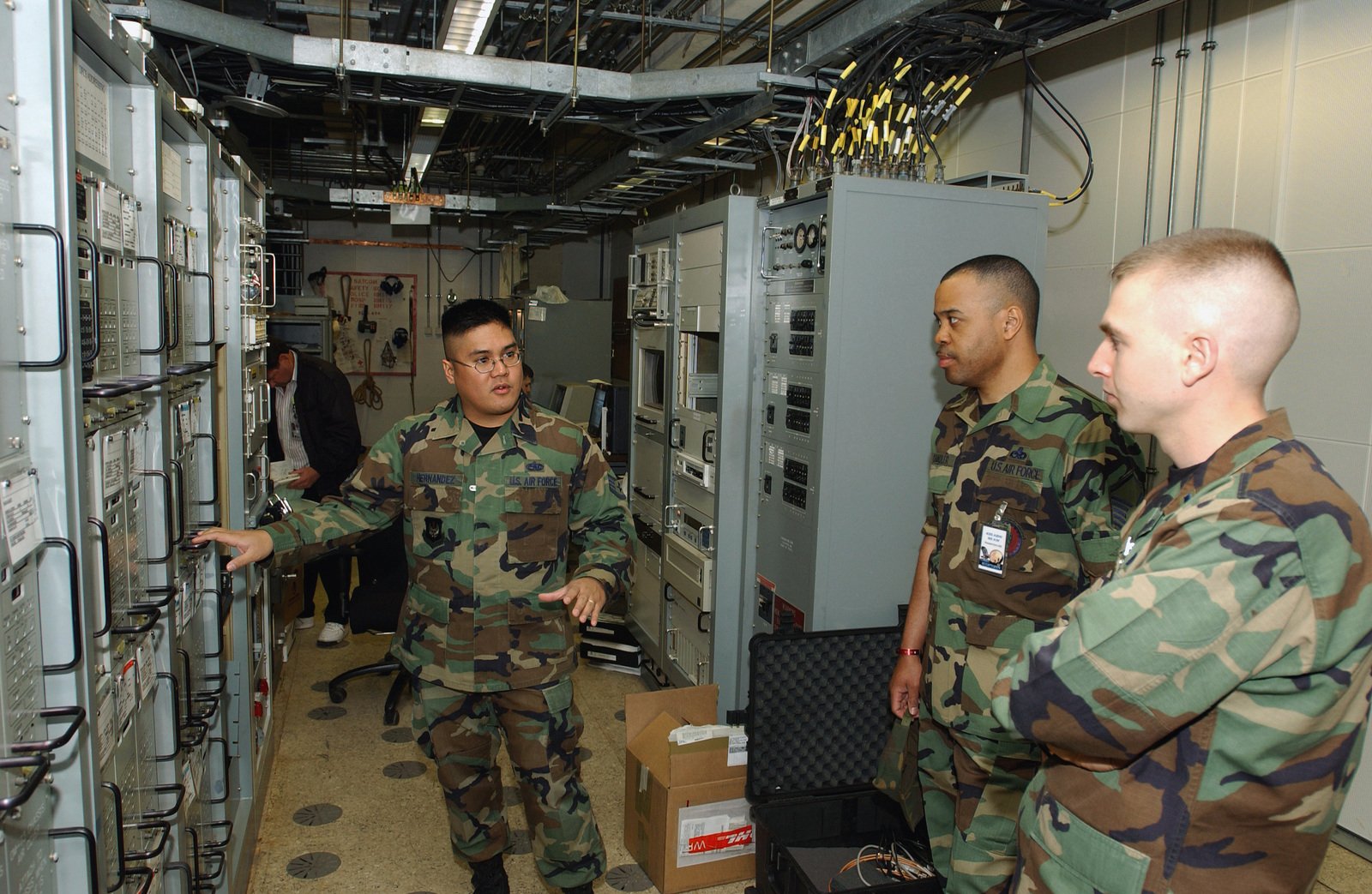 US Air Force (USAF) STAFF Sergeant (SSGT) Nolan Hernandez (left), 435th ...