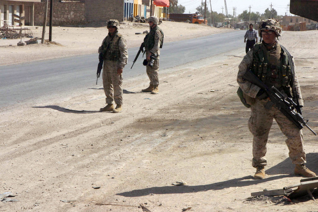 A US Marine Corps (USMC) Marine with 1ST Battalion (BN), 5th Marines ...