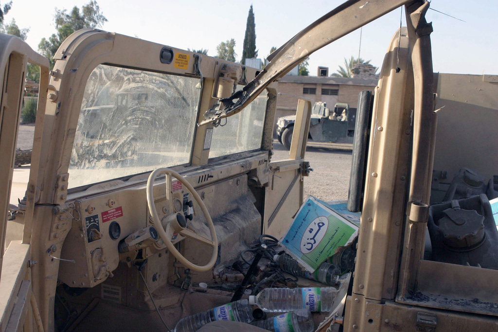 Damage to a US Marine Corps (USMC) M998 High-Mobility Multipurpose ...