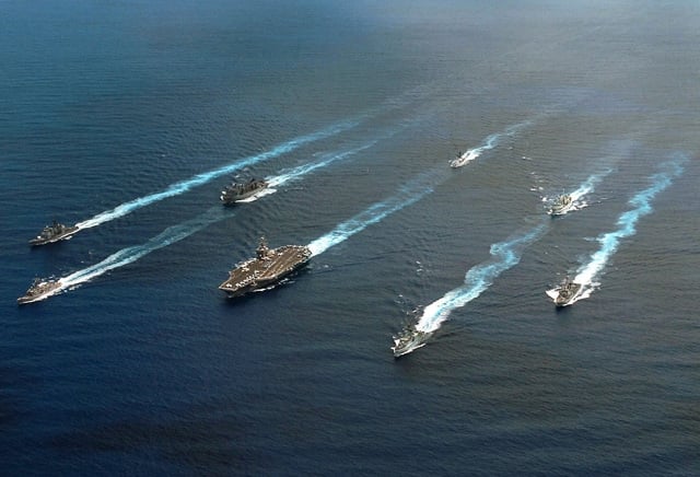 Ships from the United States and Canada navigate into formation ...