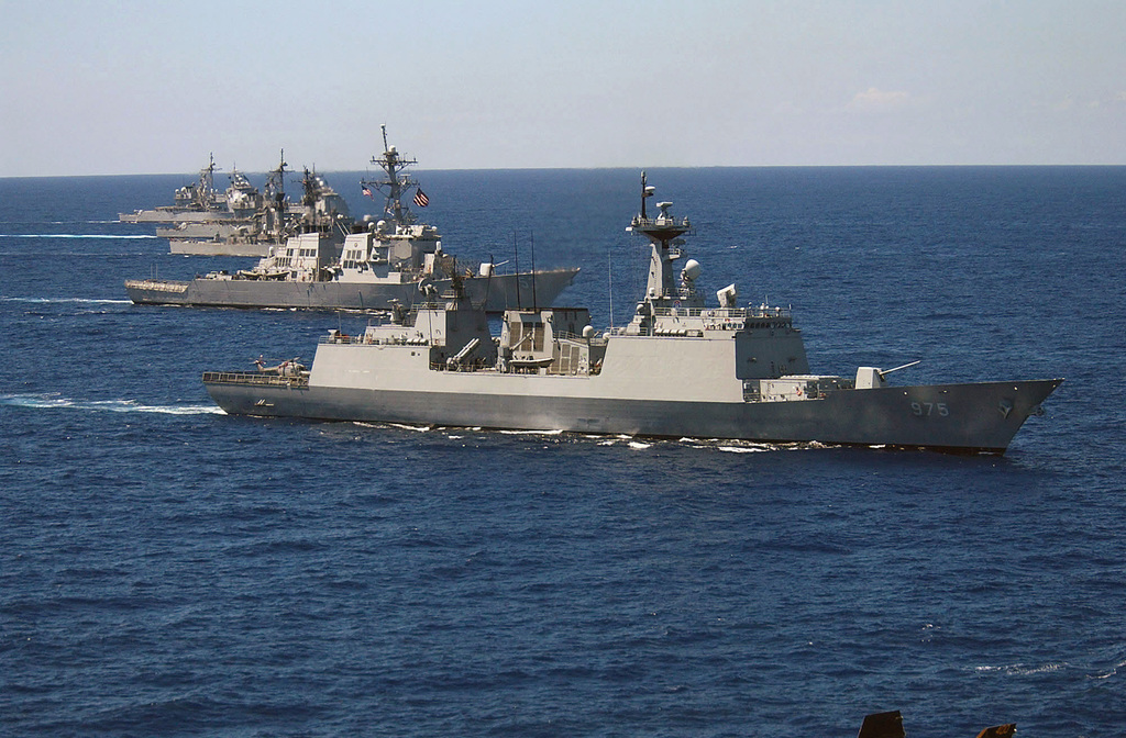 A multi-national task force group photograph of navy ships underway in ...