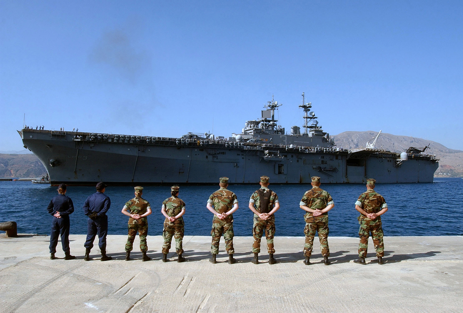 US Navy (USN) volunteer linehandlers, from Naval Station Activity (NSA) Souda Bay, wait on the pier