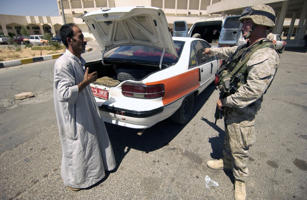 US Marine Corps (USMC) Personnel With Sergeant Potter Pulls A Suspected ...