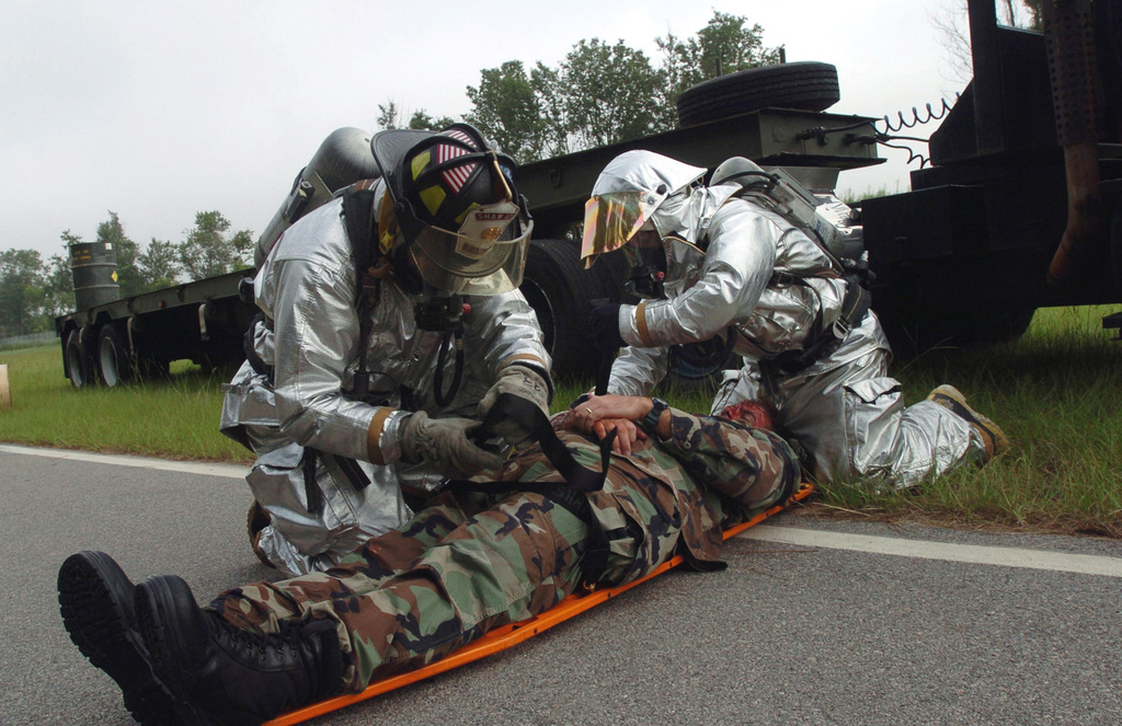 A firefighter operates a water hose during the Major Accident Response  Exercise (MARE) - NARA & DVIDS Public Domain Archive Public Domain Search