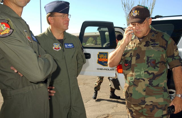 US Air Force (USAF) Colonel (COL) Michael Spencer (center), Commander ...