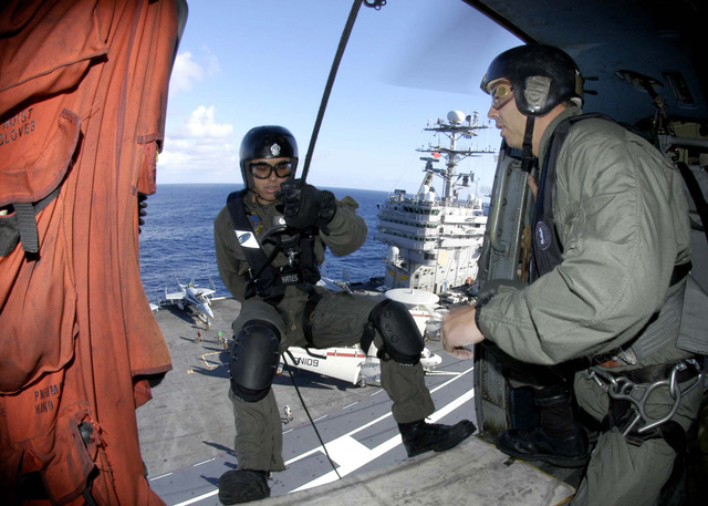 US Navy (USN) Aviation personnel assigned to Explosive Ordnance ...