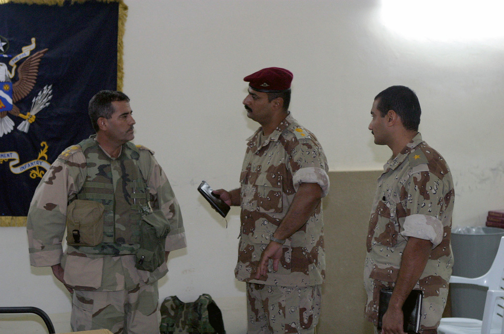 Iraqi Army Brigadier General (BGEN) Khales Ali Hussein (left ...