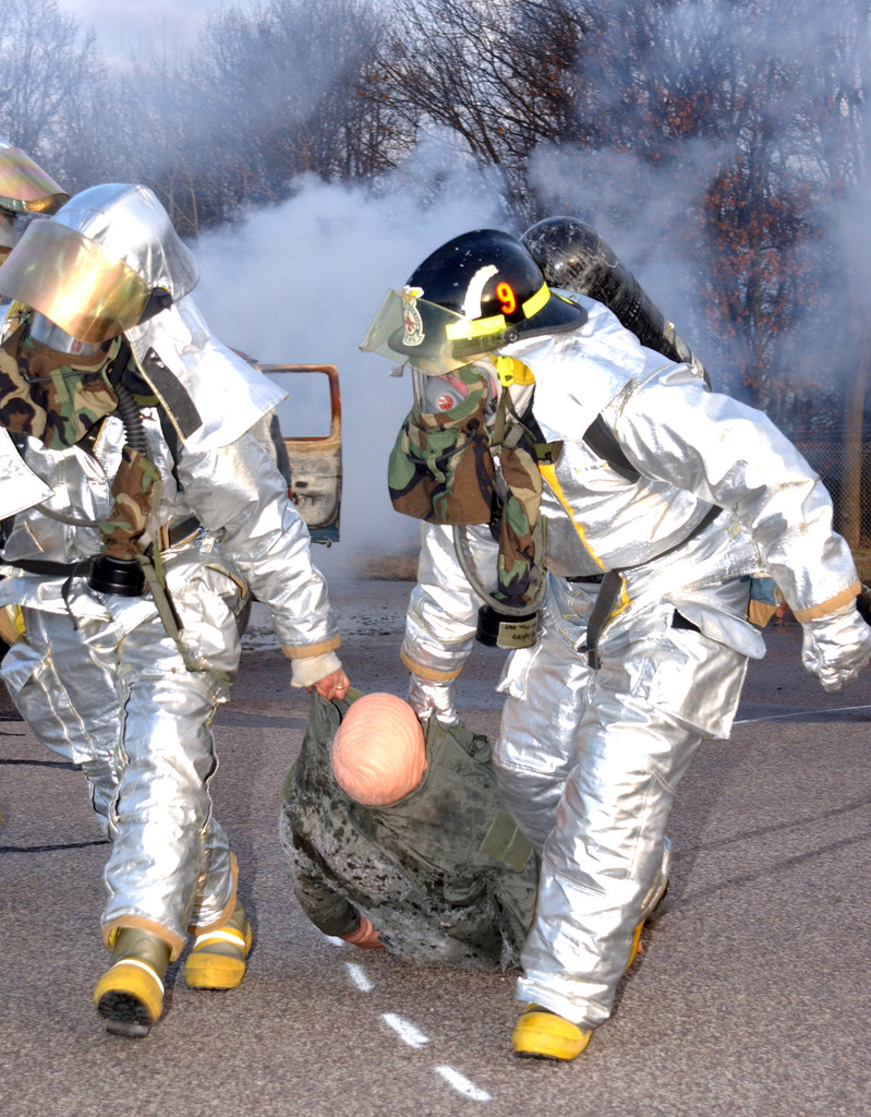 A firefighter operates a water hose during the Major Accident Response  Exercise (MARE) - NARA & DVIDS Public Domain Archive Public Domain Search