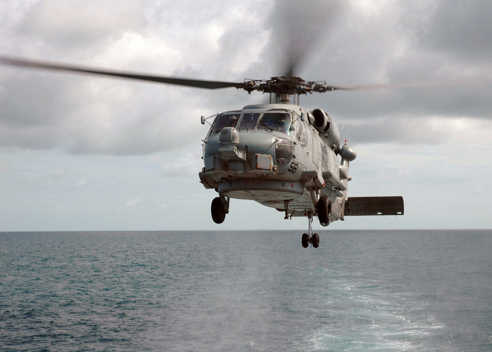 A US Navy (USN) SH-60B Seahawk helicopter, Helicopter Anti-Submarine ...