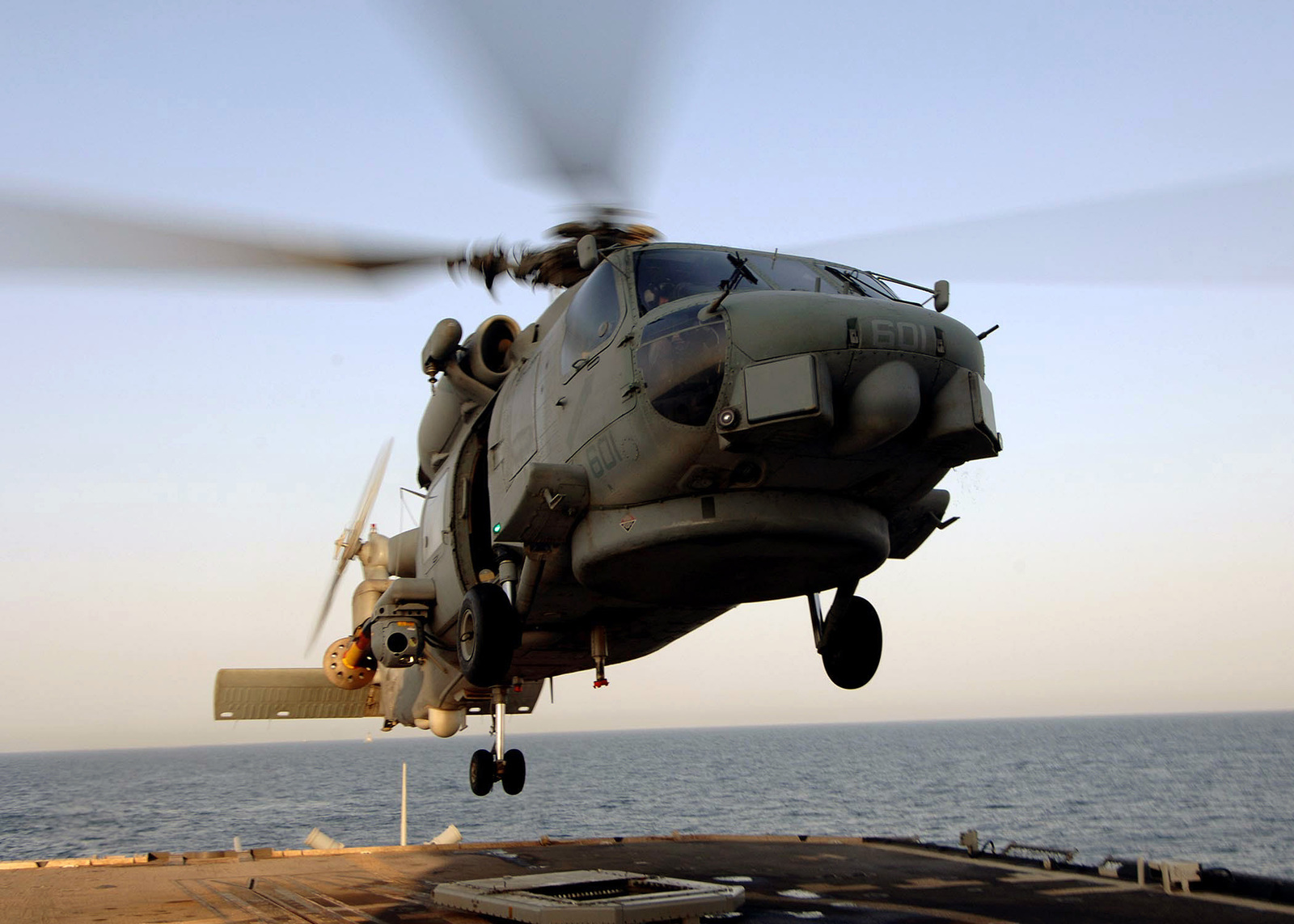 A US Navy (USN) SH-60B Seahawk helicopter, Helicopter Anti-Submarine ...