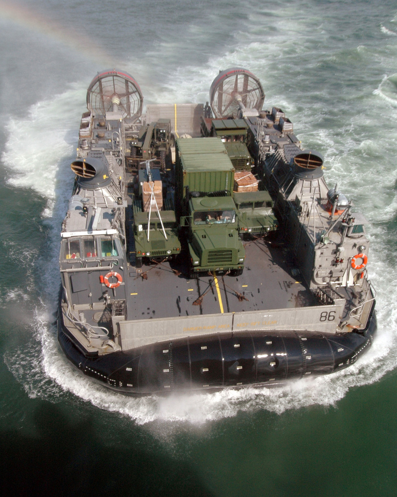 The USS Kearsarge Expeditionary Strike Group and landing craft air cushion  conduct steering maneuvers.