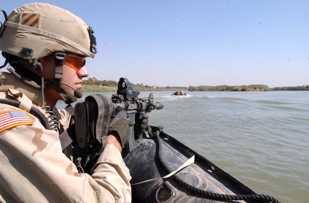 The 3-7 Cavalary, 3ID division soldiers pull securty on their way to ...