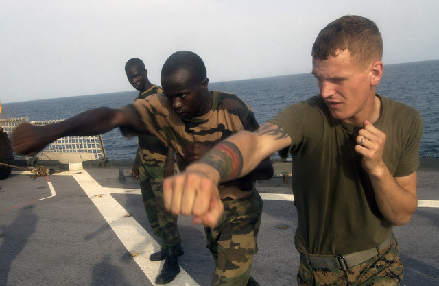 US Marine Corps (USMC) Lance Corporal (LCPL) Chuck Myers (right ...