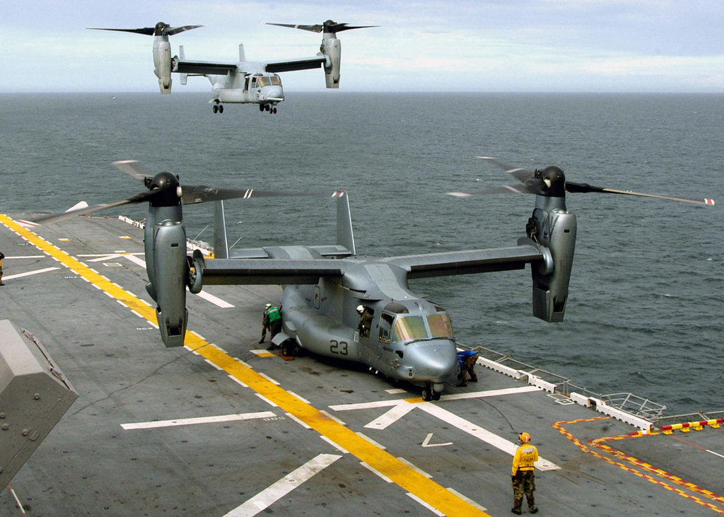 A US Marine Corps (USMC) MV-22B Osprey, Marine Tiltrotor Operational Test  and Evaluation Squadron (VMX) 22, Marine Corps Air Station (MCAS) New  River, North Carolina (NC), prepares to refuel while another Osprey
