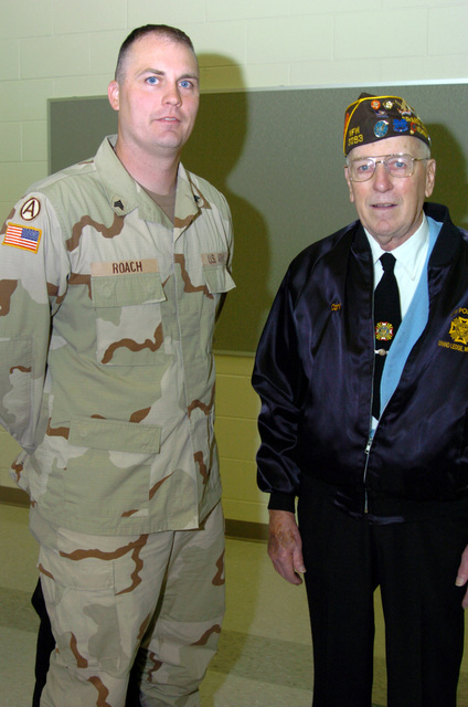 US Army (USA) Sergeant (SGT) Rodney Roach (left) assigned to the 263rd ...