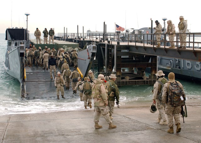 US Marine Corps (USMC) Marines board the US Navy (USN) Landing Craft ...