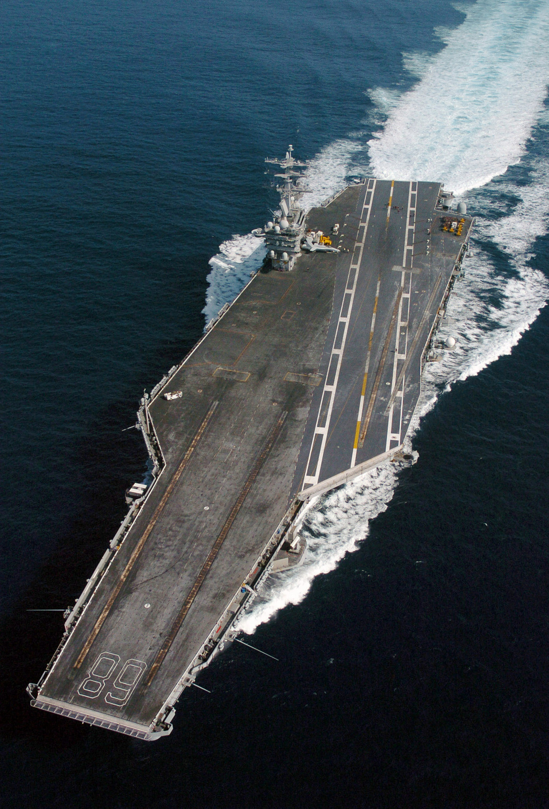 Aerial high oblique view of the US Navy (USN) Aircraft Carrier, USS ...