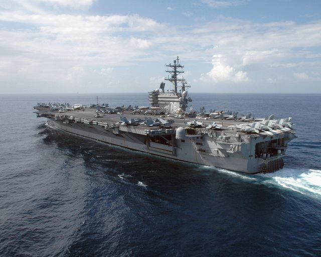 A quarter stern port view of the US Navy (USN) Nimitz Class Aircraft ...