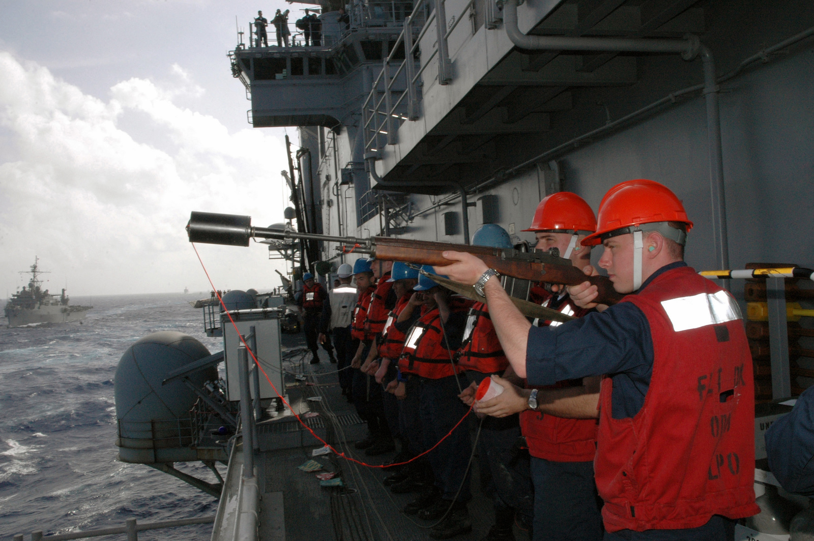 US Navy (USN) Gunners Mate, SEAMAN (SN) Travis D. Parker, onboard the ...