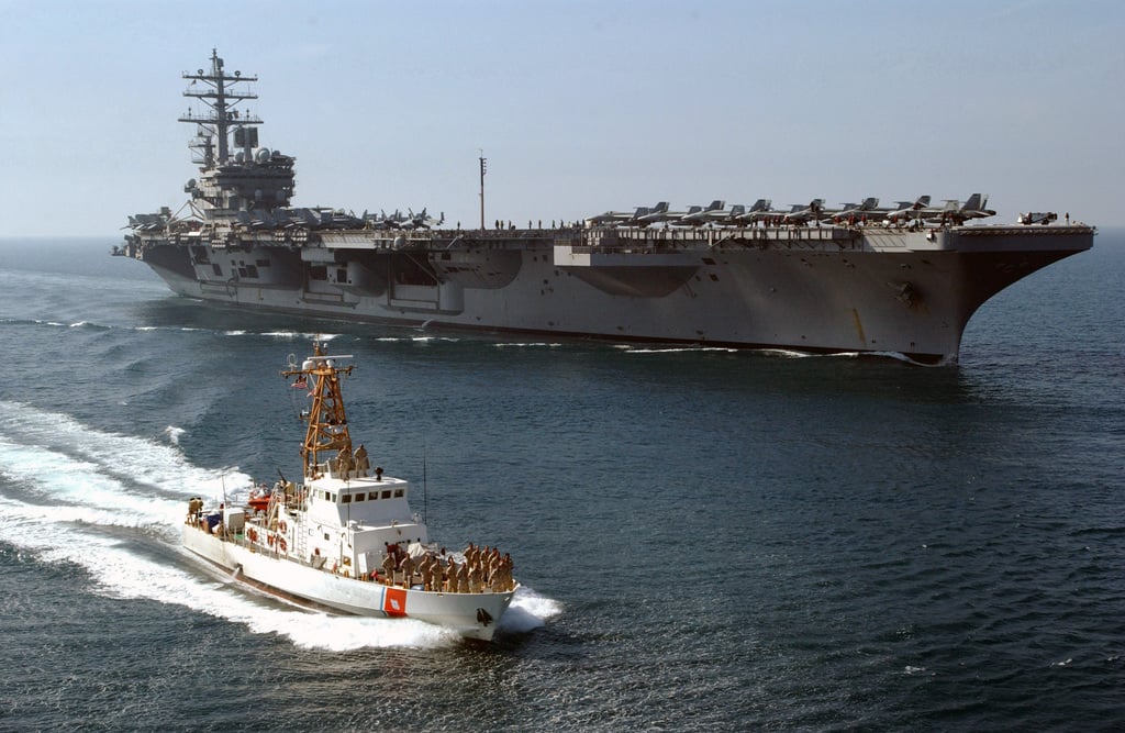 United States Coast Guard (USCG) members stationed aboard the patrol ...