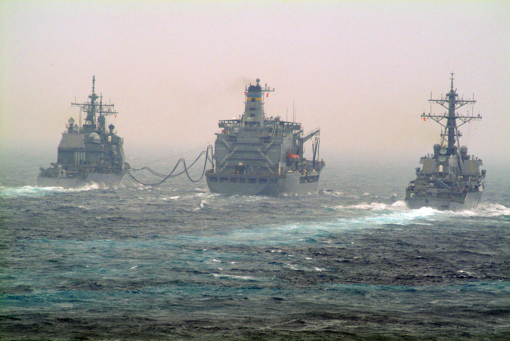 A Stern View Showing Us Navy Usn War Ships Conducting Underway Replenishment Unrep While Sailing In The East China Sea Pictured Left To Right The Ticonderoga Class Guided Missile Cruiser Aegis Uss Chanellorsville Cg