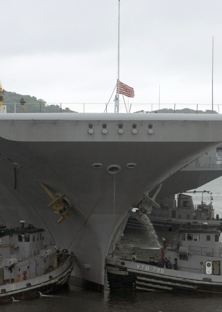 As Us Navy Usn Large Harbor Tugs Push The Usn Aircraft Carrier Uss Kitty Hawk Cv 63 A Usn