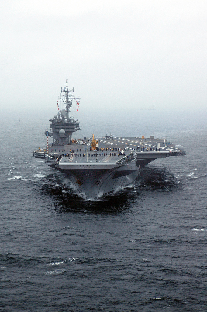 The US Navy (USN) Aircraft Carrier USS KITTY HAWK (CV 63) steams out of ...