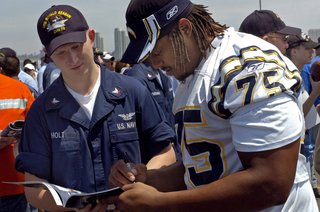 060811-N-7526R-093 (Aug. 11, 2006)San Diego Chargers running back LaDanian  Tomlinson (56) looks on as his team conduct awalk-throughon the flight  deck aboard US Navy (USN) Nimitz Class Aircraft Carrier USS RONALD REAGAN (