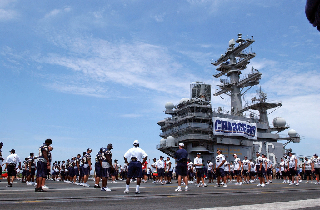 060811-N-7526R-093 (Aug. 11, 2006)San Diego Chargers running back LaDanian  Tomlinson (56) looks on as his team conduct awalk-throughon the flight  deck aboard US Navy (USN) Nimitz Class Aircraft Carrier USS RONALD REAGAN (