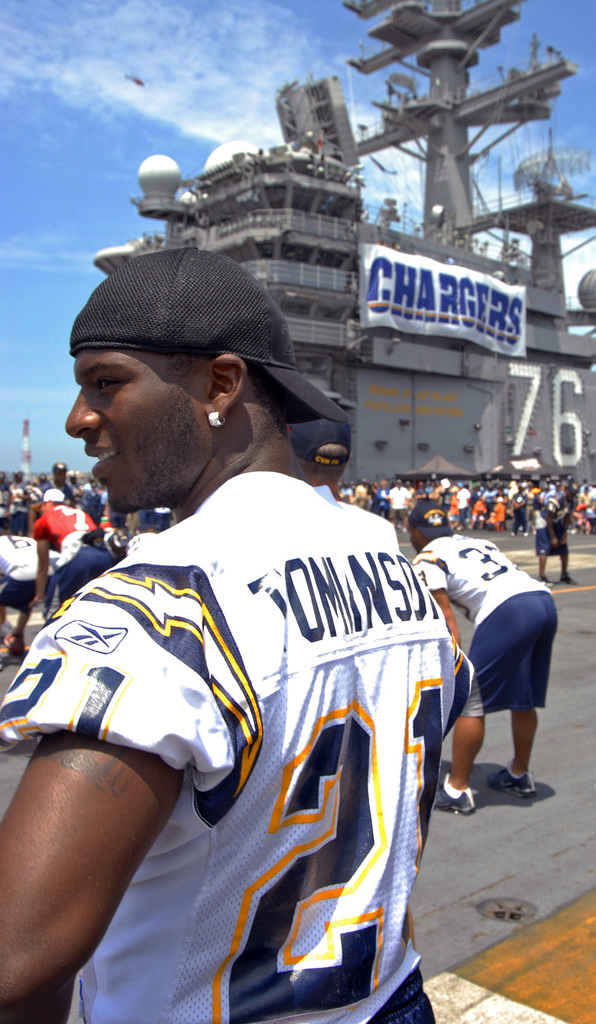 060811-N-7526R-093 (Aug. 11, 2006)San Diego Chargers running back LaDanian  Tomlinson (56) looks on as his team conduct a'walk-through'on the flight  deck aboard US Navy (USN) Nimitz Class Aircraft Carrier USS RONALD REAGAN (