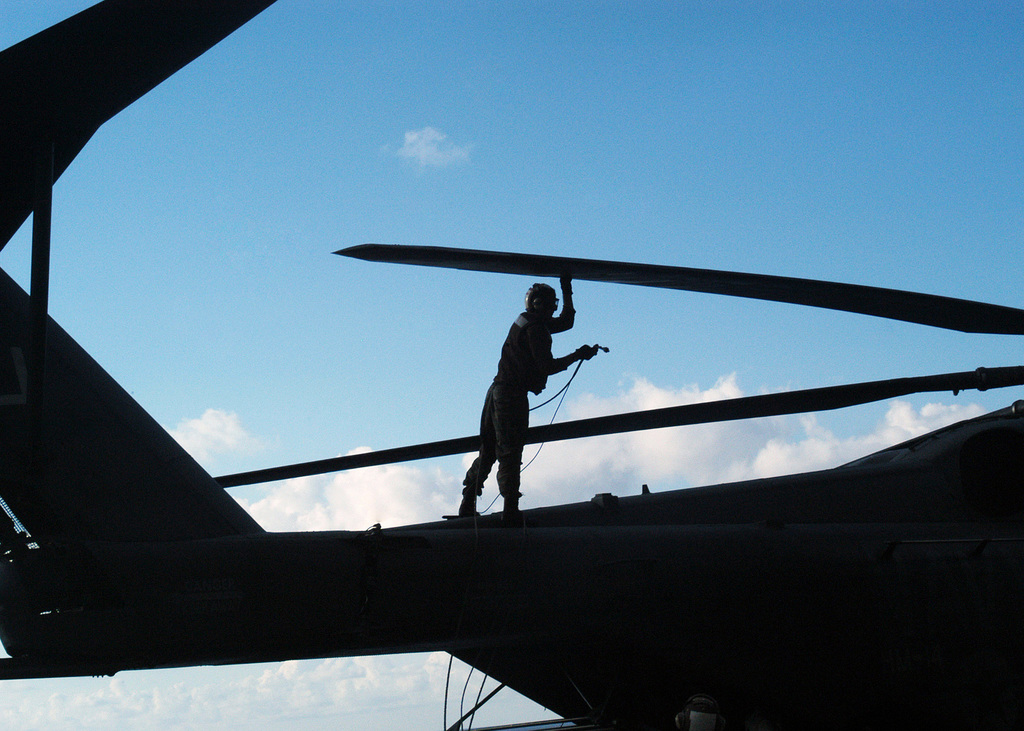 A U.S. Navy Sailor with the Helicopter Mine Countermeasure Squadron 15 ...