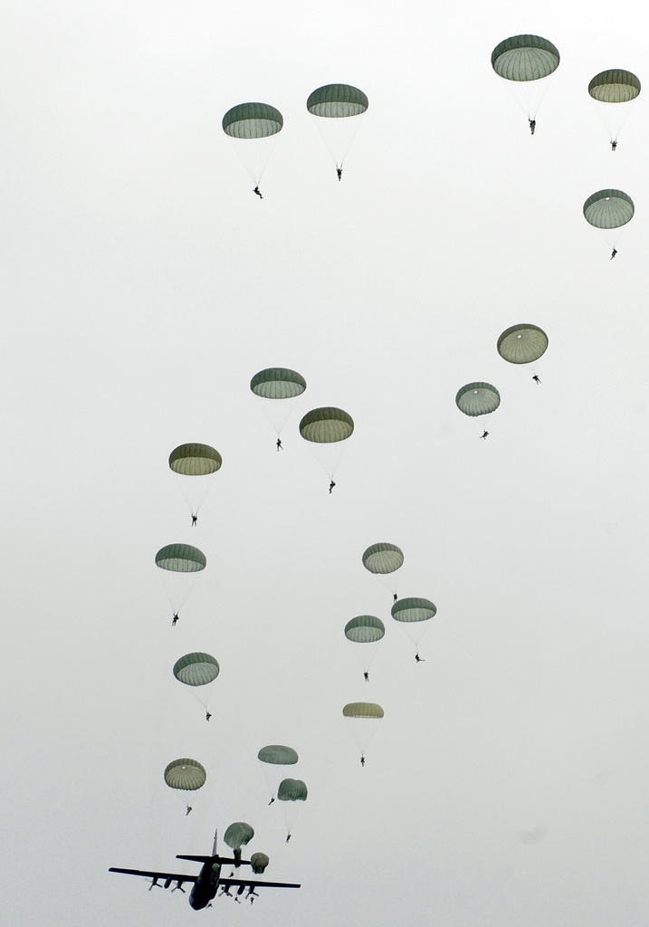 The C-130 Hercules transporter fills the ski with paratroopers from the ...