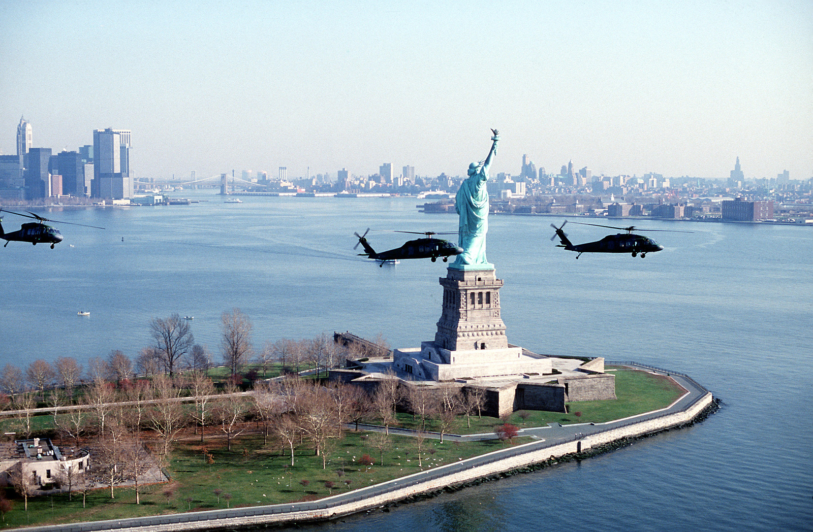 Right Side View Of Three Uh-60a Black Hawk Helicopters Flying Near The 