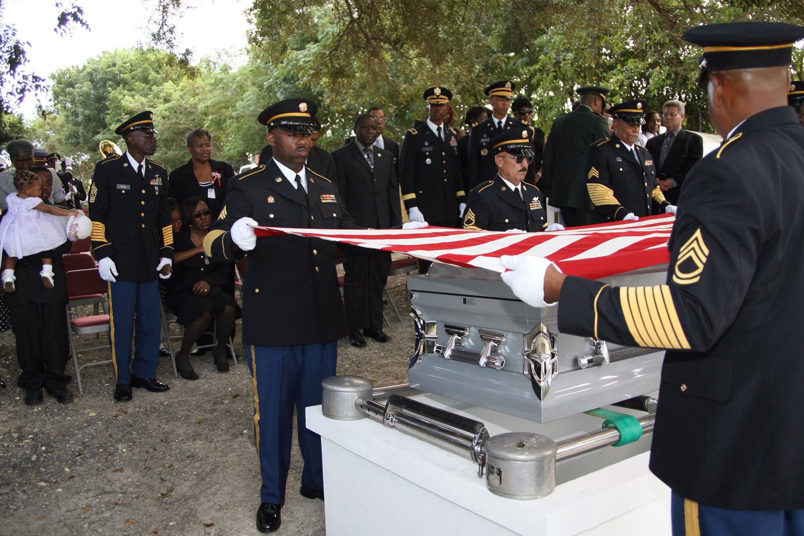 The U.S. Army Funeral Detail folds the flag that draped the casket of U ...