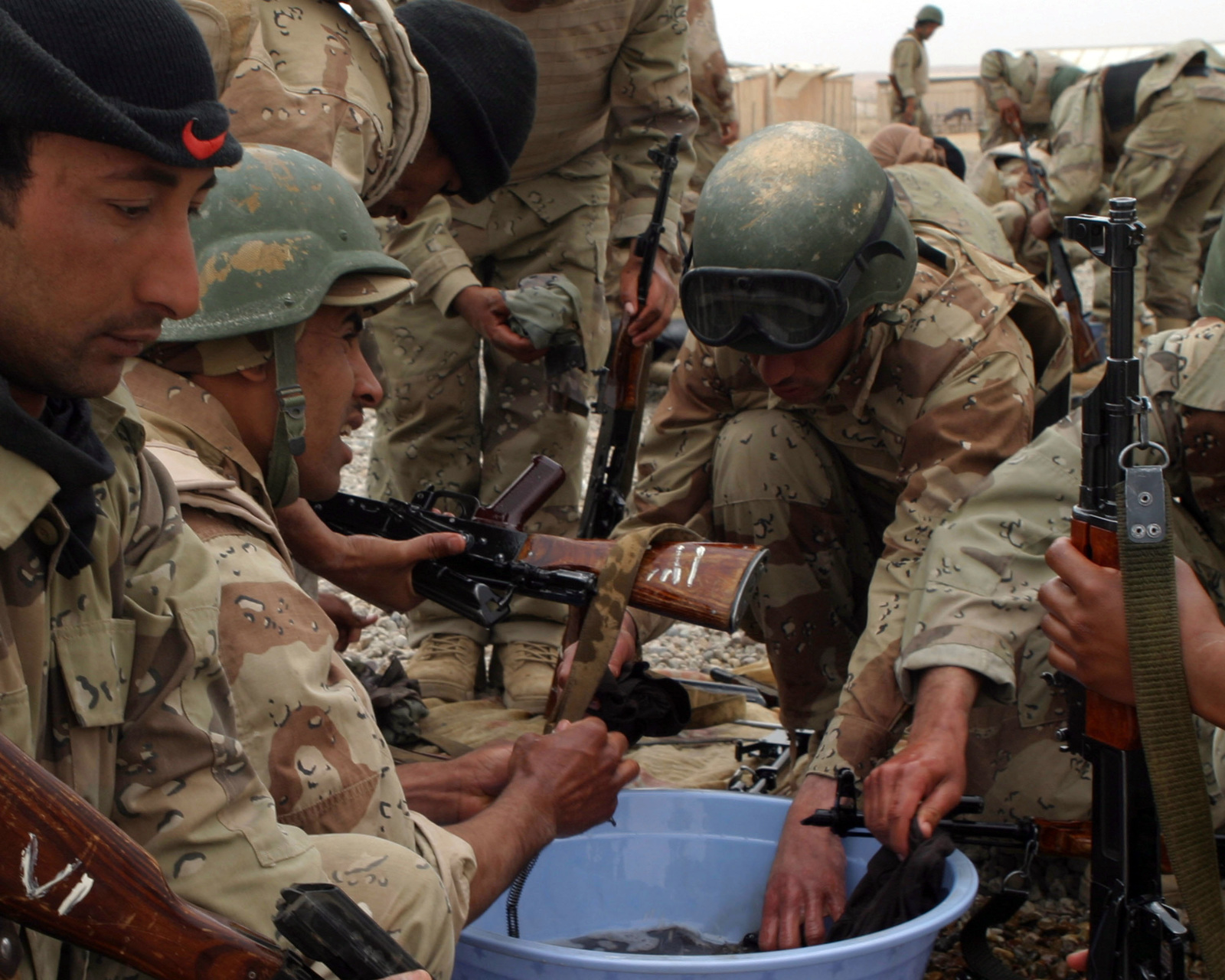Iraqi Army Soldiers In The School Of Infantry (Soi) Clean Their Rifles  After Training At Cam Yasser On Al Asad Air Base, Iraq On March 24, 2007.  Soi Is A Ten Day