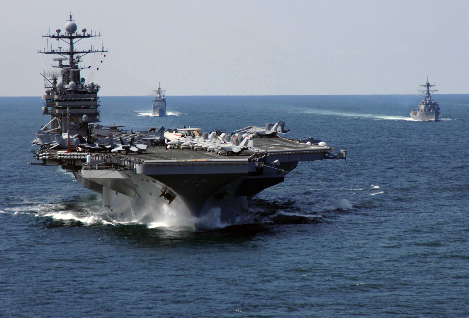 The U.S. Navy Nimitz Class Aircraft Carrier (front) USS HARRY S. TRUMAN ...