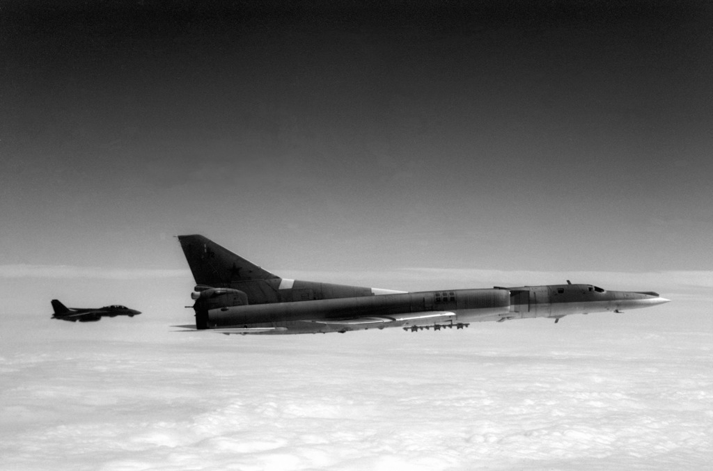 A Soviet Tu-22M Backfire-B Bomber Aircraft Is Escorted By An F-14A ...