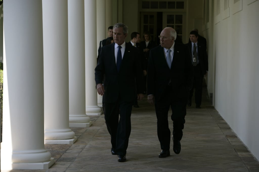 President Bush And Vice President Cheney Walk Through The White House