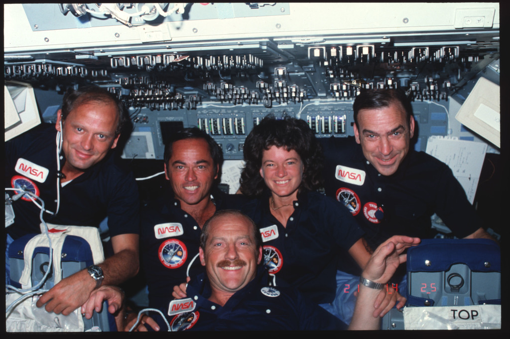 S07-15-671 - STS-007 - Crew members pose for group portrait on forward ...