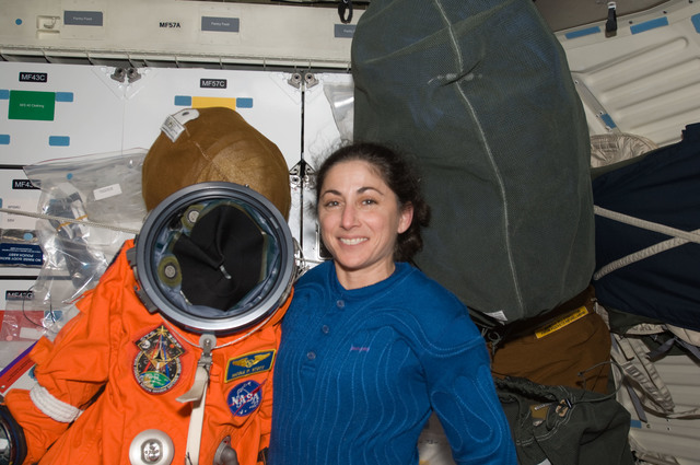 S129E011117 - STS-129 - View of MS Stott posing for a photo on the ...