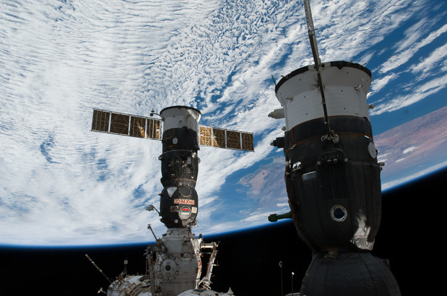 S130e009990 - Sts-130 - View Of Progress And Soyuz From Cupola Window 