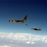 A Fighter Squadron 84 (VF-84) F-14A Tomcat aircraft flies beside an Air  force KC-135E Stratotanker aircraft after an aerial refueling over  southeastern Turkey. The aircraft are operating in support of Operation  Provide