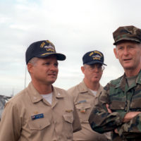 GEN. Walter E. Boomer, assistant commandant of the Marine Corps, converses  with a Marine officer aboard the amphibious transport dock USS TRENTON  (LPD-14) following his arrival on base to observe a special